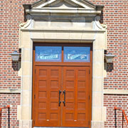 Church doors greet parishioners with the natural beauty and eternal  appeal of wood, without the maintenance