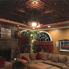 Decorative dropped ceiling panels are an effective way to glamour up an old ceiling in need of a facelift