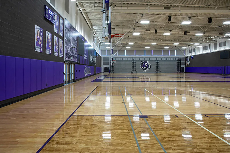 Millennium High School – Goodyear, Arizona. Products: TF20B – Front Folding Backstops, Divider Curtain, Power Volleyball System, Wall Pads, EZ Pad Plus Control System. Dealer & Installer: Norcon Industries, Inc. Photographer: Matt Oberer.