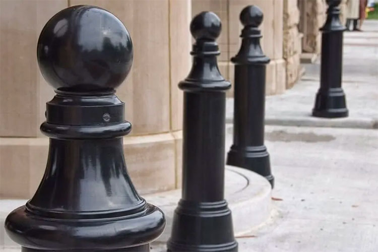 Decorative bollards are both functional and elegant on a sidewalk.