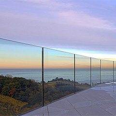 Structural glass railings systems have no posts and thin, optional cap rails. Enjoy your view with zero visual obstruction!