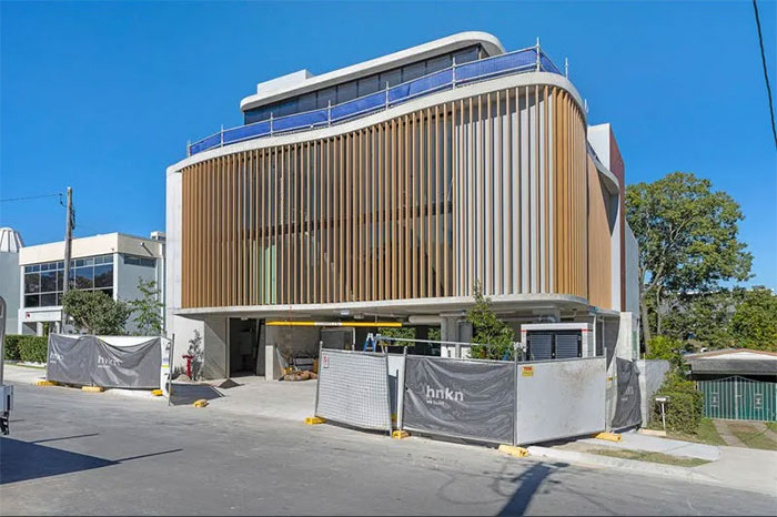 The 96 Eugaree office building shows off a “coastal modernist” look and offers 1,065 m2 (11,715 ft2) of office space and a covered parking garage.